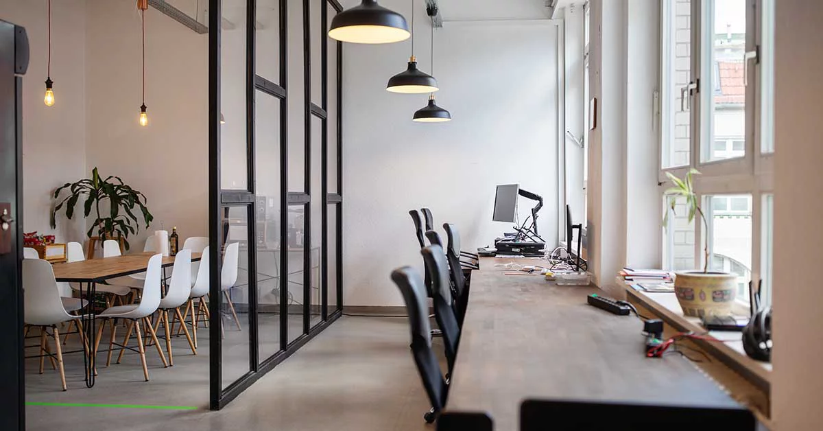 office bay view with a common table and chairs