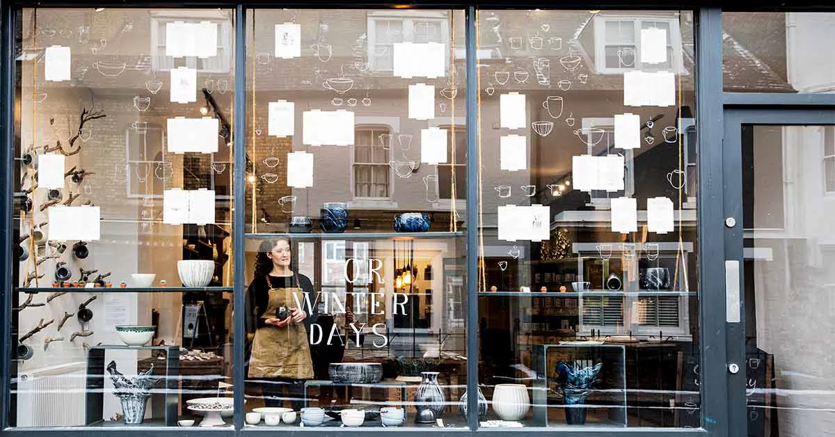 View through window into a pottery shop