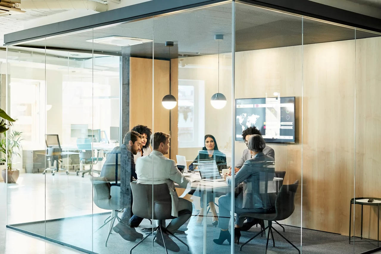 Business colleagues sitting at conference table