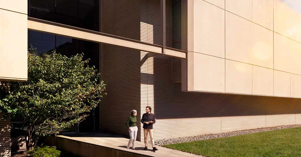 People walking through data centre building