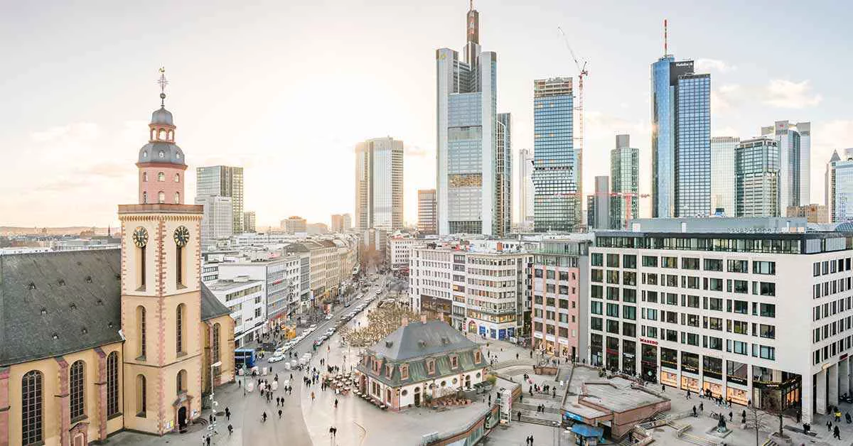 Aerial view of Frankfurt showcasing its skyline, buildings, and urban landscape from a high vantage point.