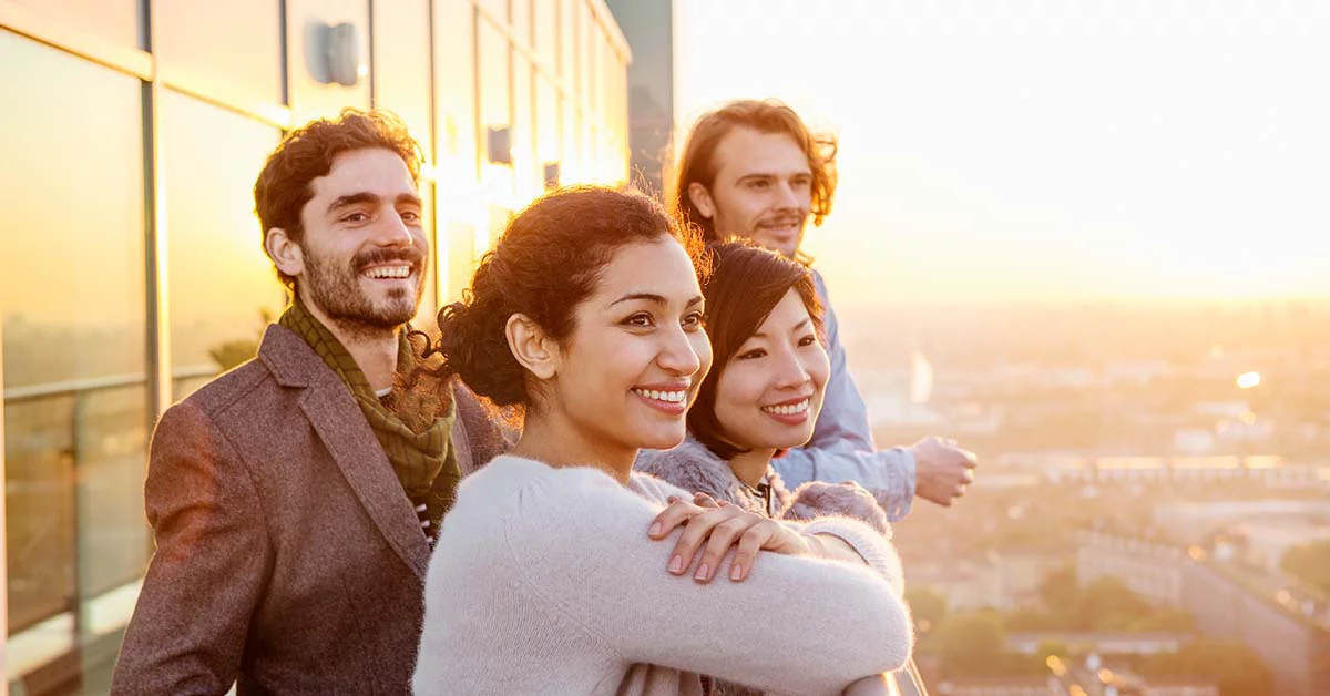 People are standing in balcony with happy faces