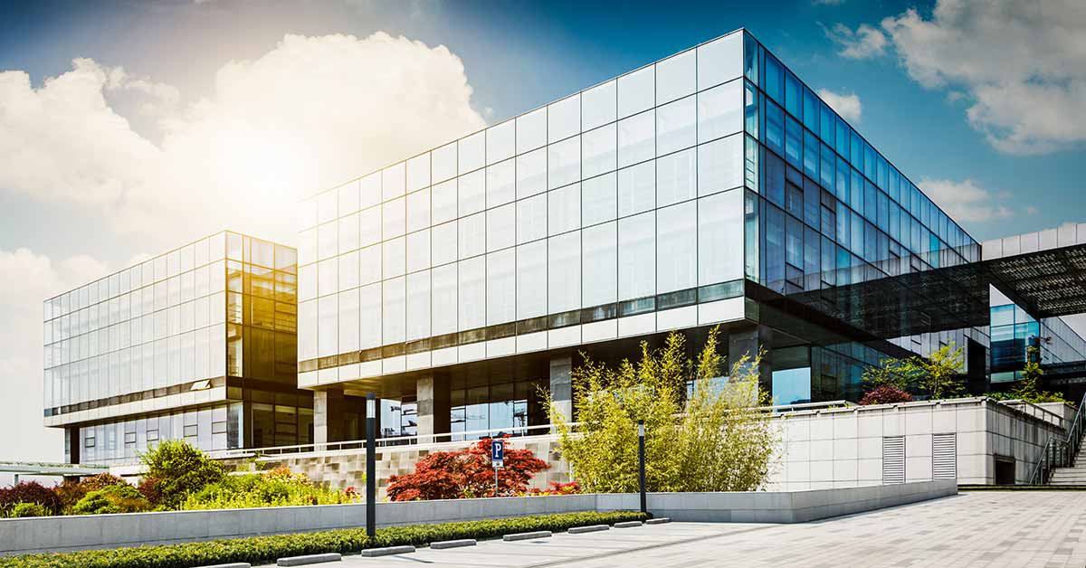 Modern multi-story office building with extensive glass curtain wall facade