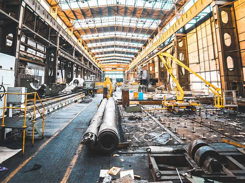 Large industrial manufacturing facility or warehouse interior with exposed steel framework