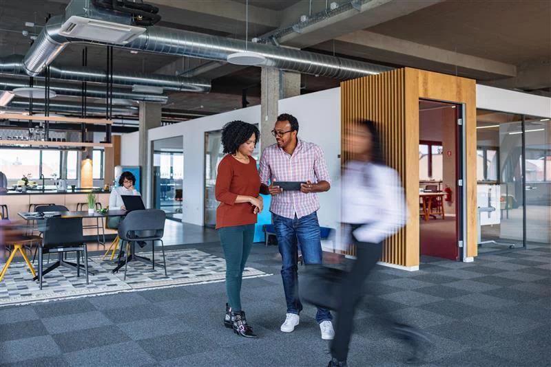 Colleagues talking in the office