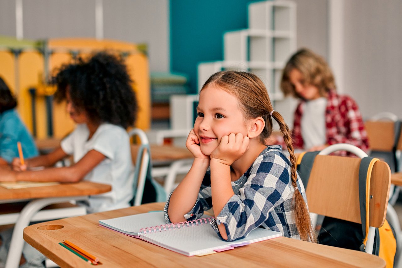 Back to school. Multiracial pupils of primary school are ready to study.