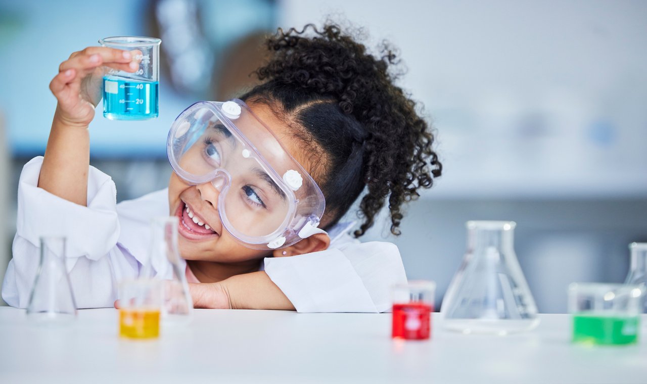 Science, eduction and smile with child in laboratory for experiment, learning and research.