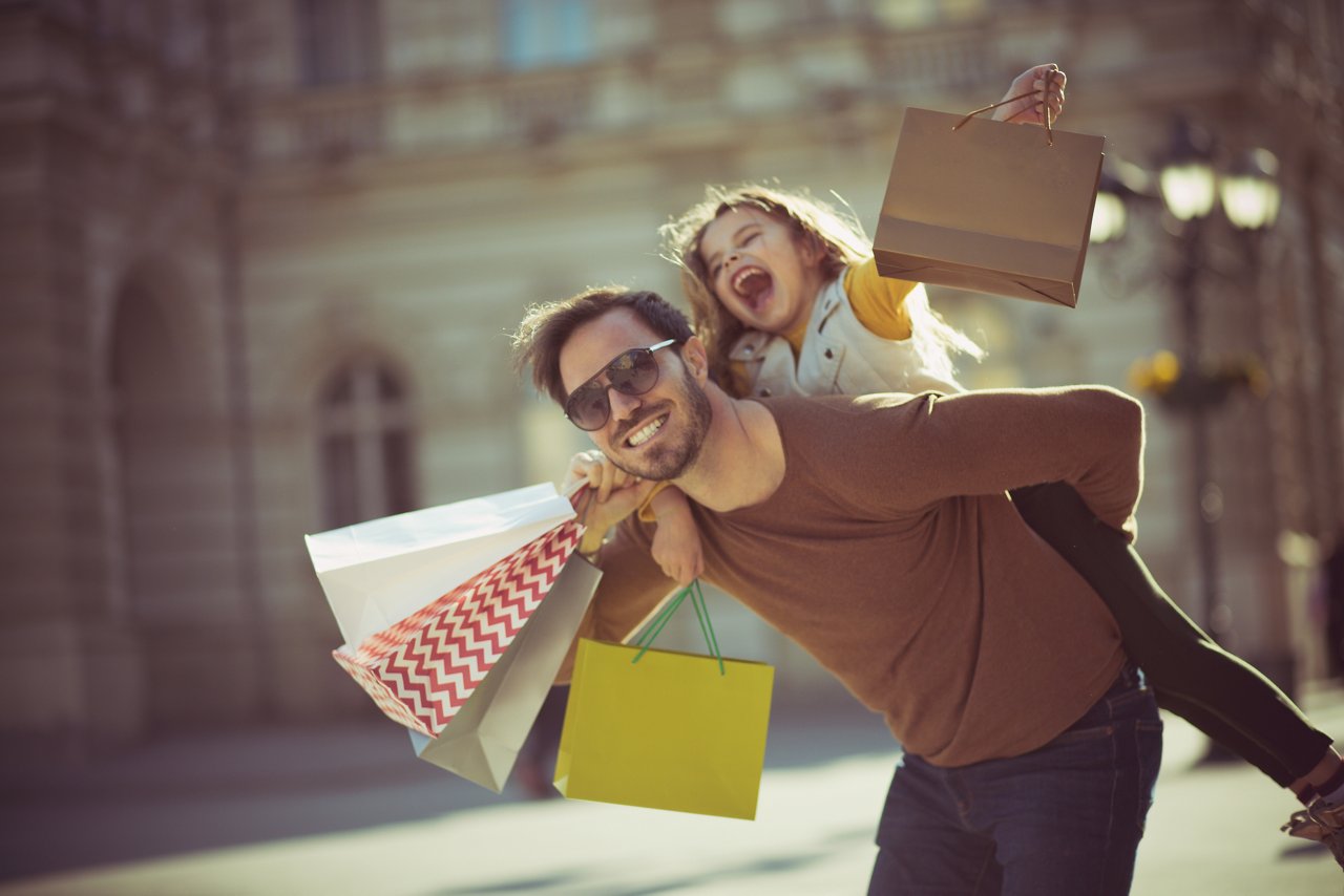 My little girl is my world. Father and daughter shopping in the city.