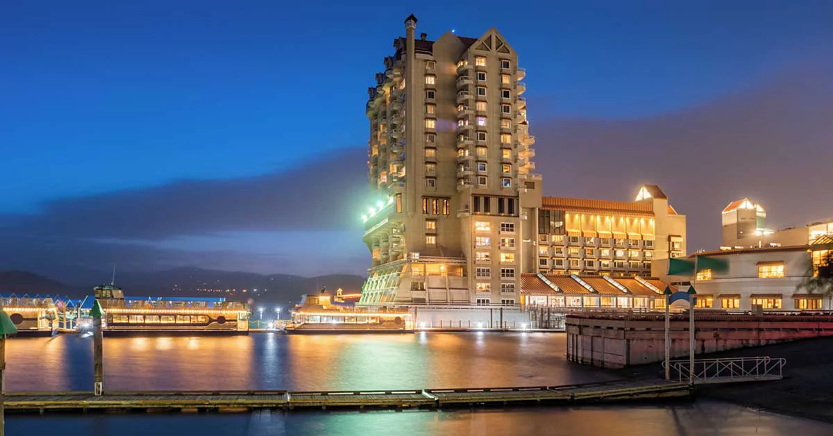 Lakeside resort under evening lights