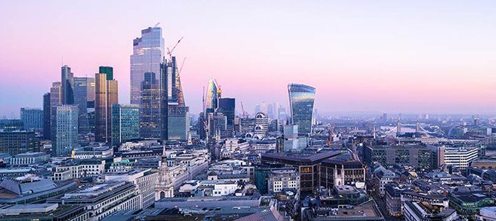 Aerial view of London's financial district skyline at dusk