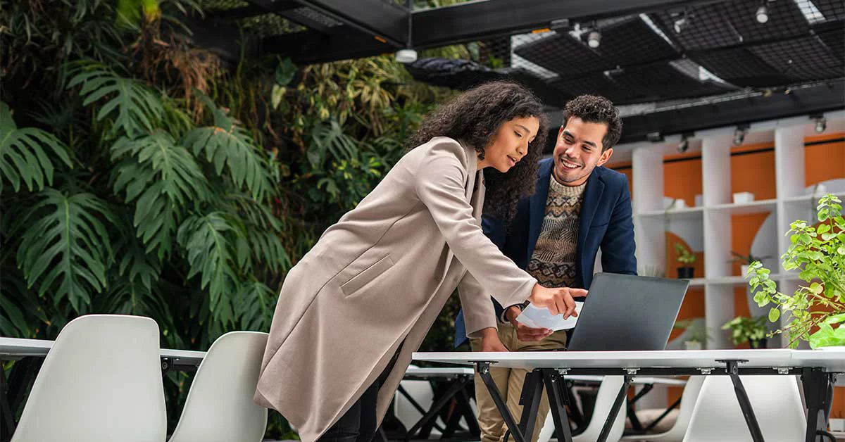 Coworkers are working as a team to solve a company activity