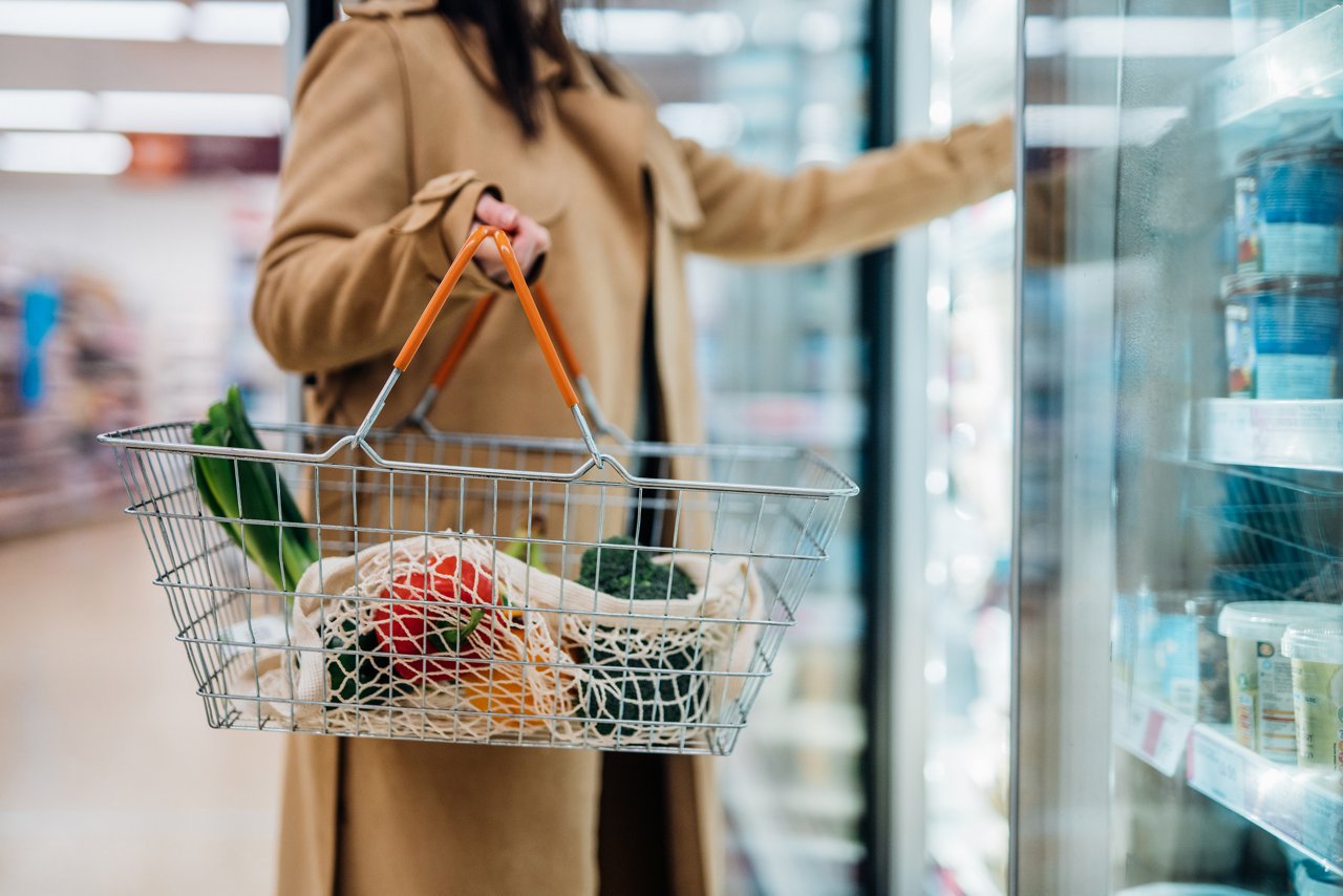 Close up shot of woman carrying shopping basket