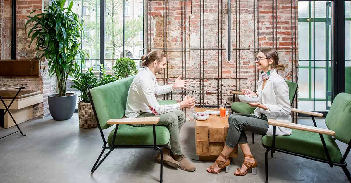 A man and a woman sitting at a cafe.