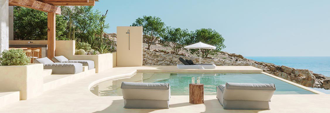 resort by the beach with a pool