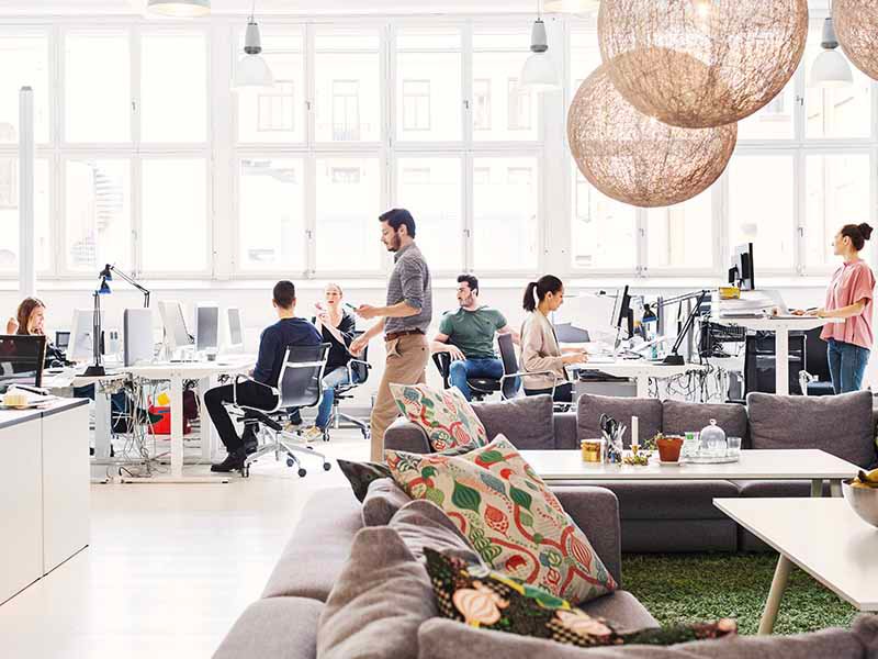 Modern office lobby with business people working in background
