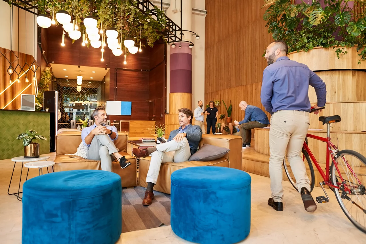 Welcoming workplace lobby with people sitting and talking