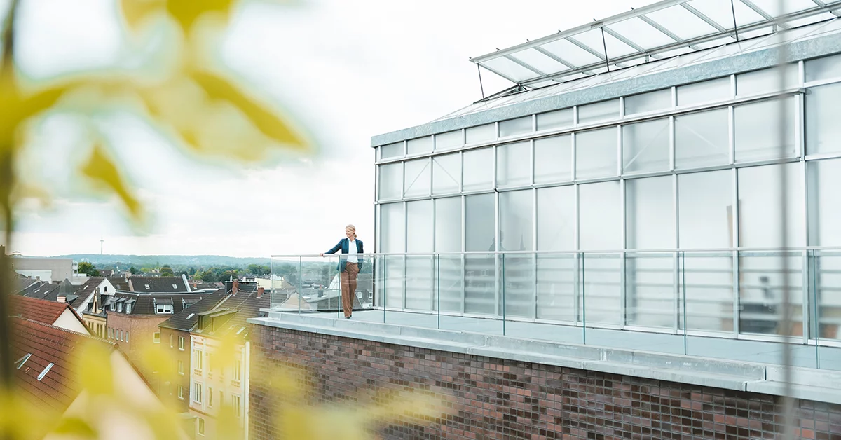 Businesswoman standing in office balcony