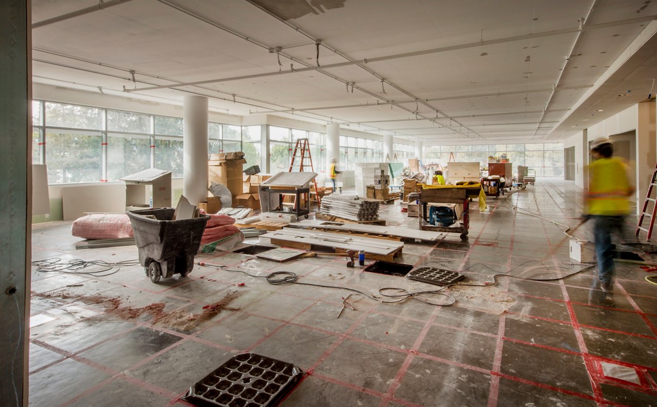 Workers finishing tenant improvements in a new office building.