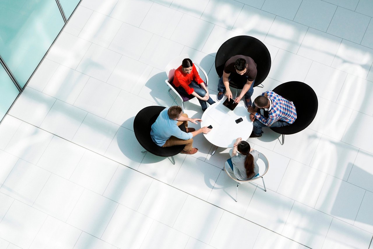 Group of professionals sitting together and discussing