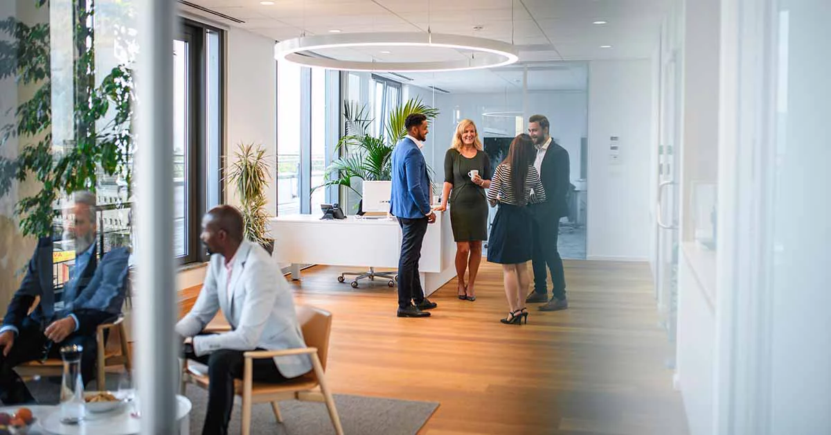Several employees working together in an office.