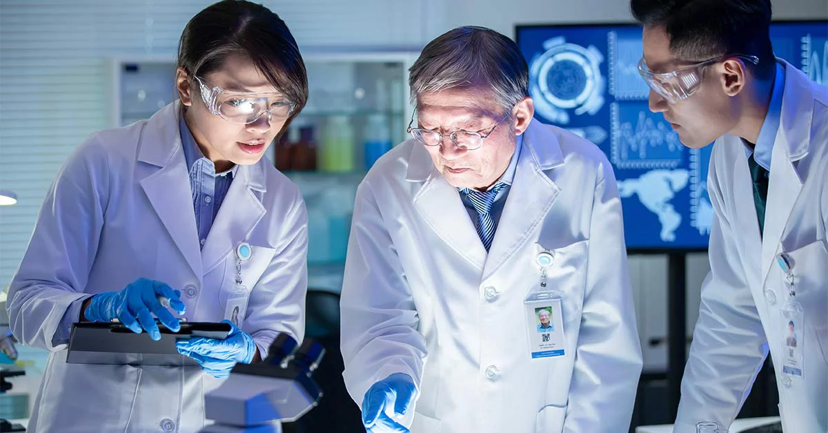 Two technicians are working in a lab