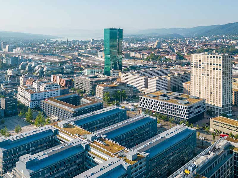 A panoramic view of Zurich, Switzerland, showcasing its historic architecture and scenic lakefront.