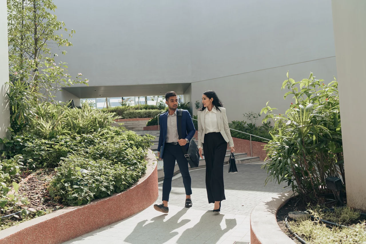 Indian Businessman and businesswoman going to work