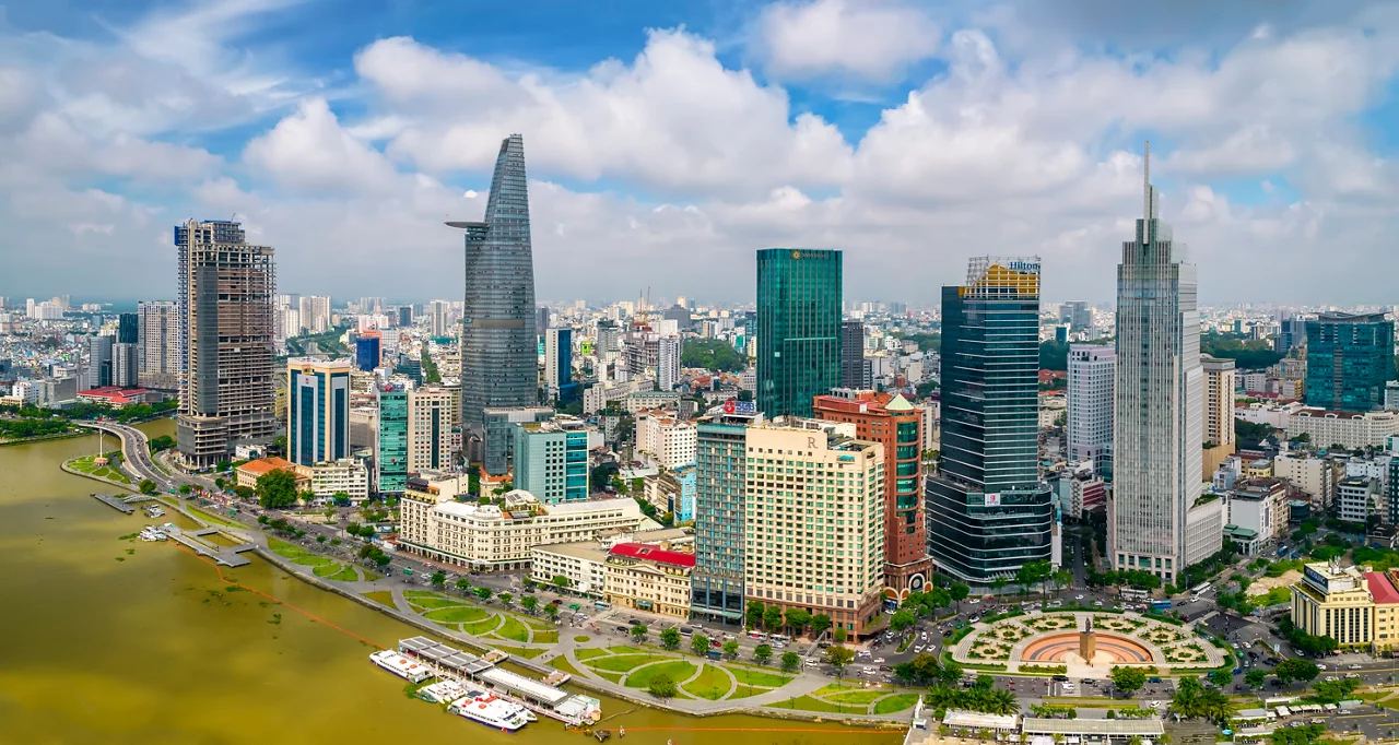 Top view aerial photo from flying drone of a Ho Chi Minh City with development buildings, transportation, energy power infrastructure. Financial and business centers in developed Vietnam