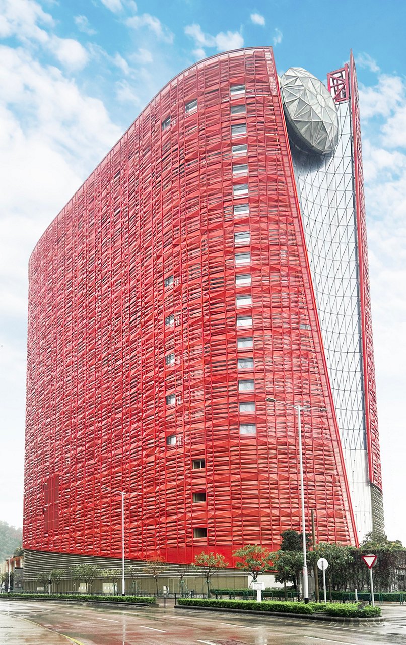Modern high-rise building with distinctive red brick facade