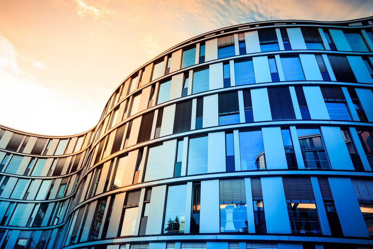 "Glass facade of a modern office building in Hamburg, Germany.Blue toning with a warm, gold colored reflection due to the use of a blue-gold-polarizer.Cross-Processed.Taken with: Canon 5D Mark 3 / 24mm 1.4L II"