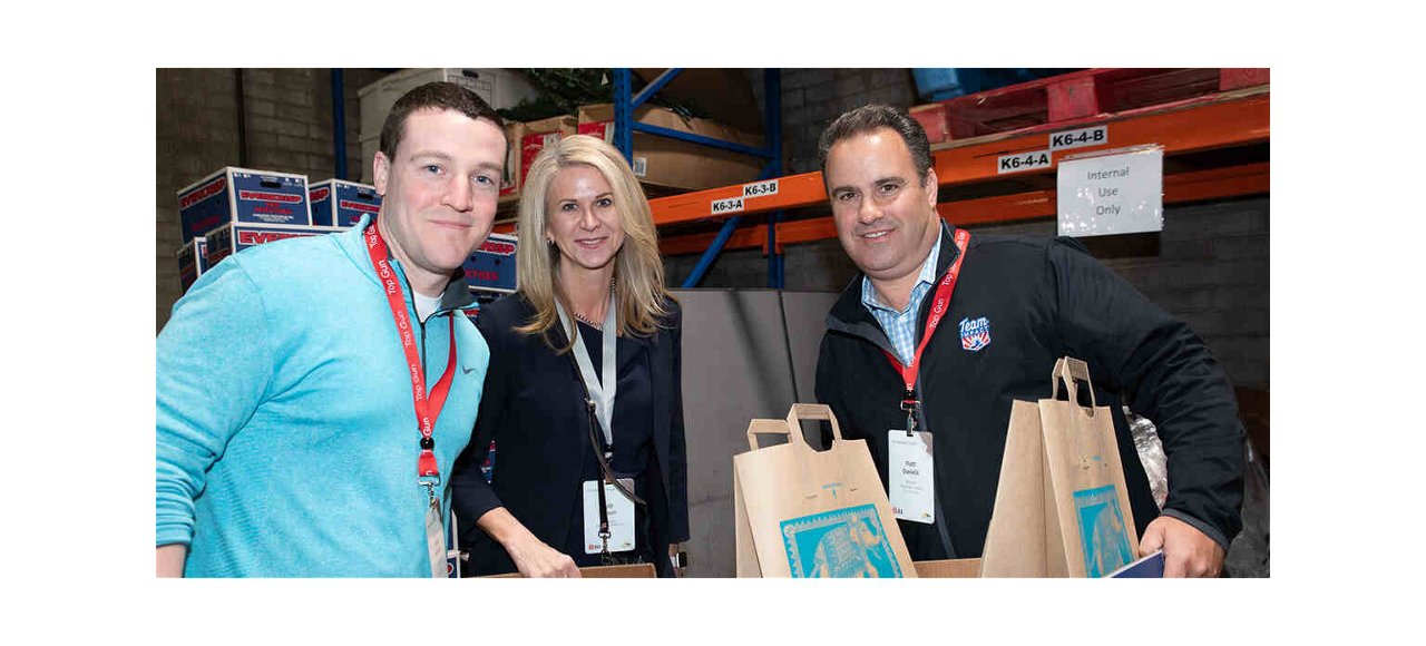 three people posing for a picture in an event