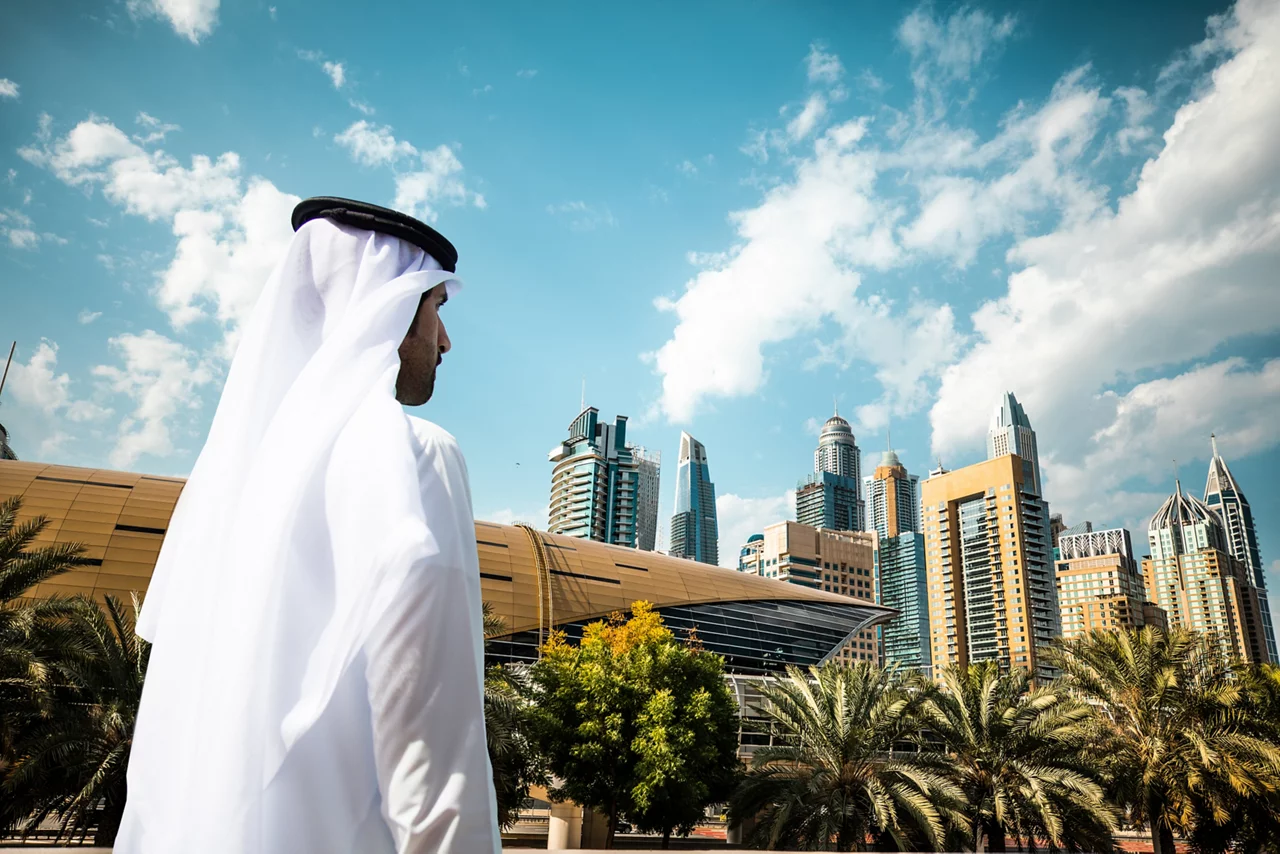 A man looking towards buildings
