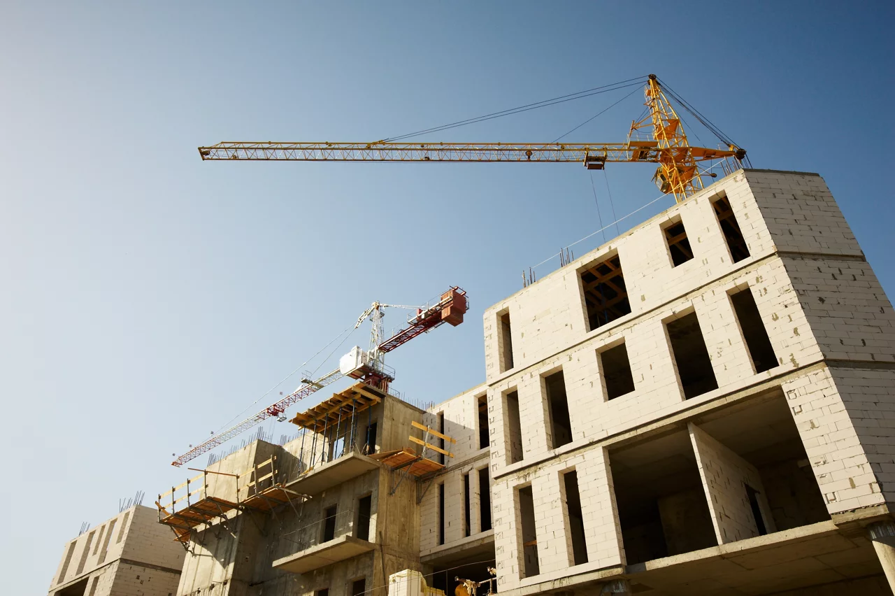 Housing being built with crane in view