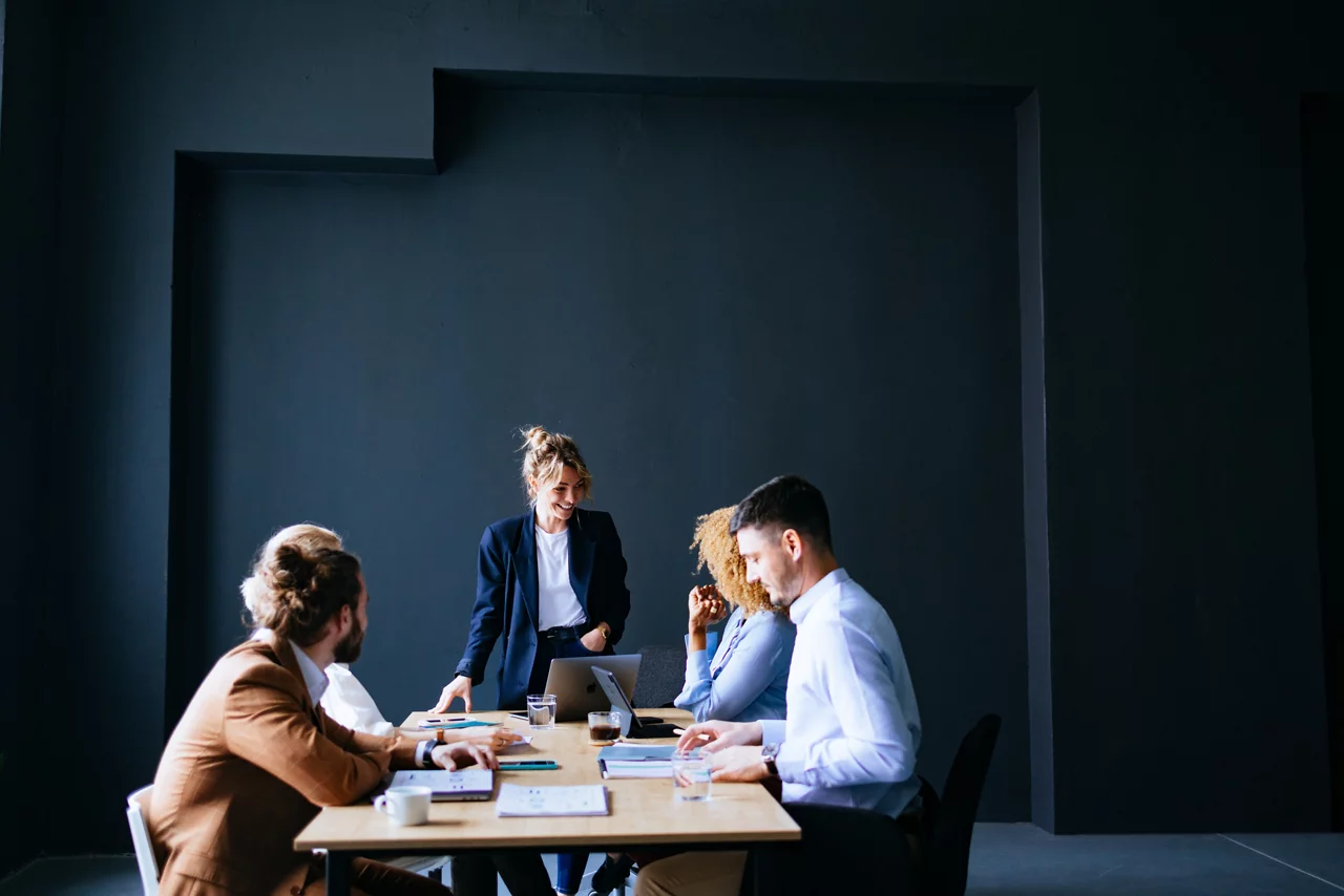 People talking about business strategy together during a meeting at the office desk