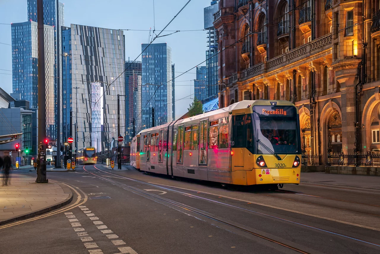 Tram going through Manchester city centre
