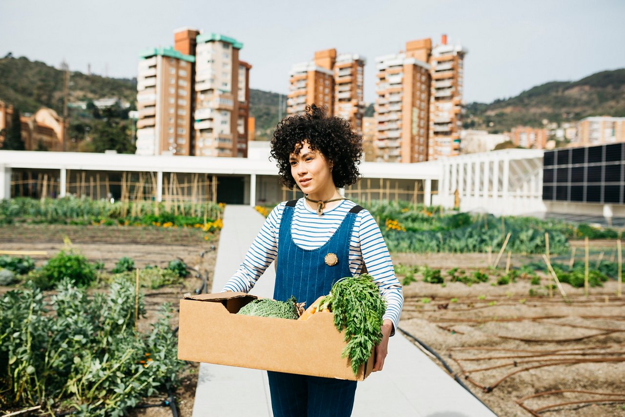 A woman holding a vegetable basket