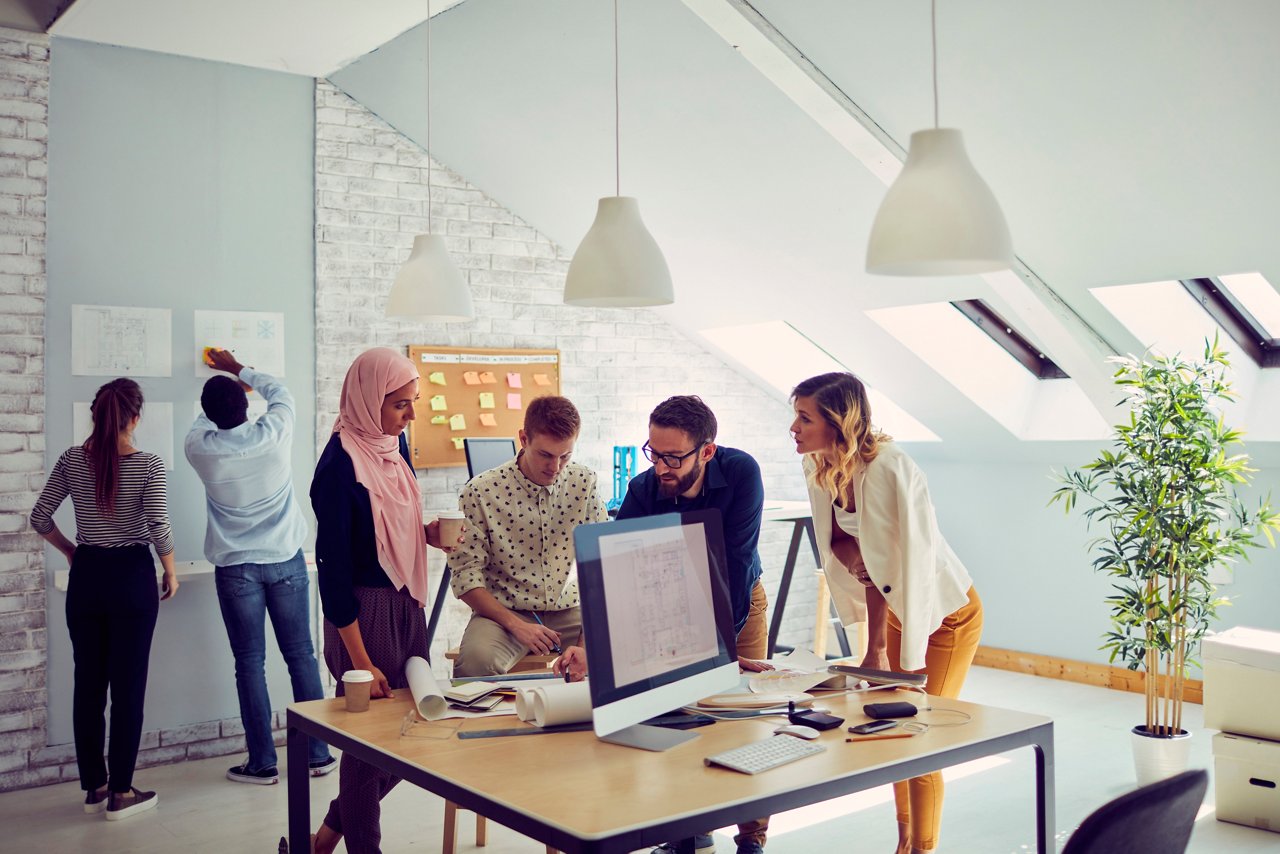 Diverse business team of architects discussing in the office.