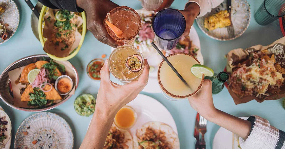 People holding juice in the restaurant