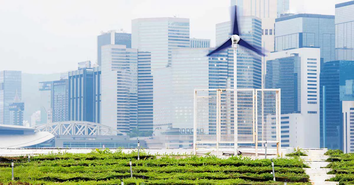 Buildings with windmill and greenery