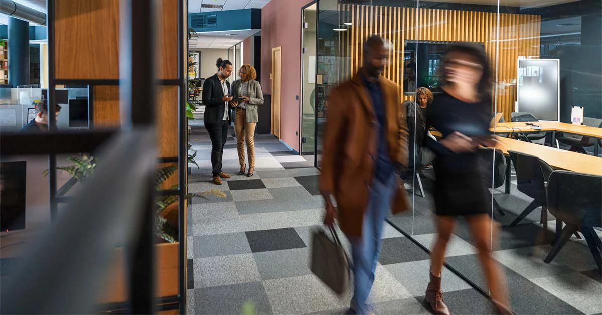 Businessman walking with-briefcase outside office