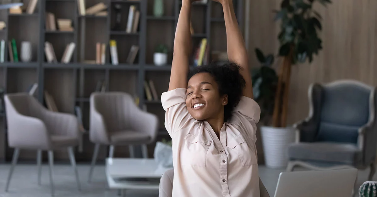 Woman stretching in a office