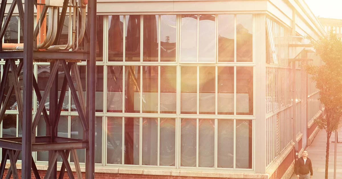 A person standing near building