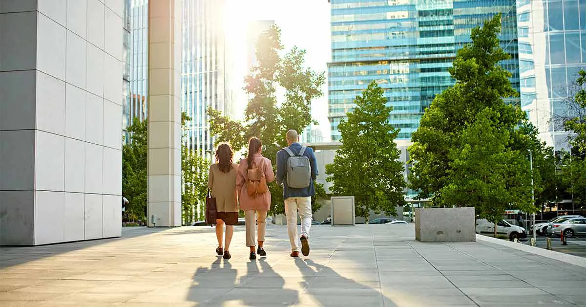 Colleagues walking through an office district