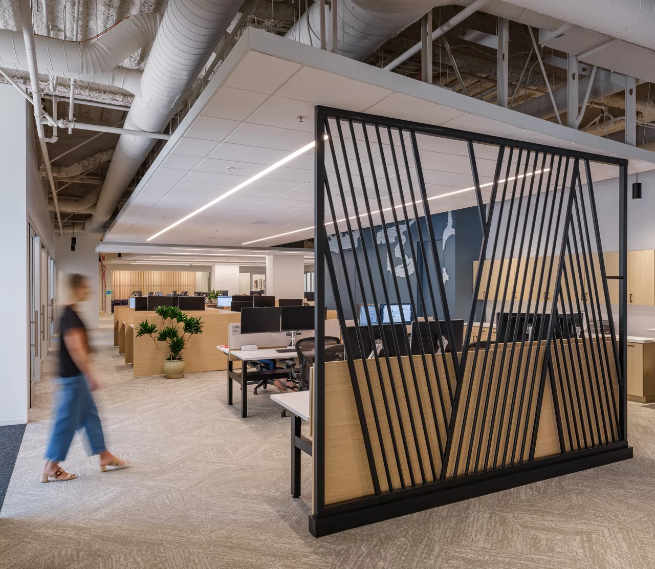Open office space featuring a desk and chairs arranged for collaborative work.