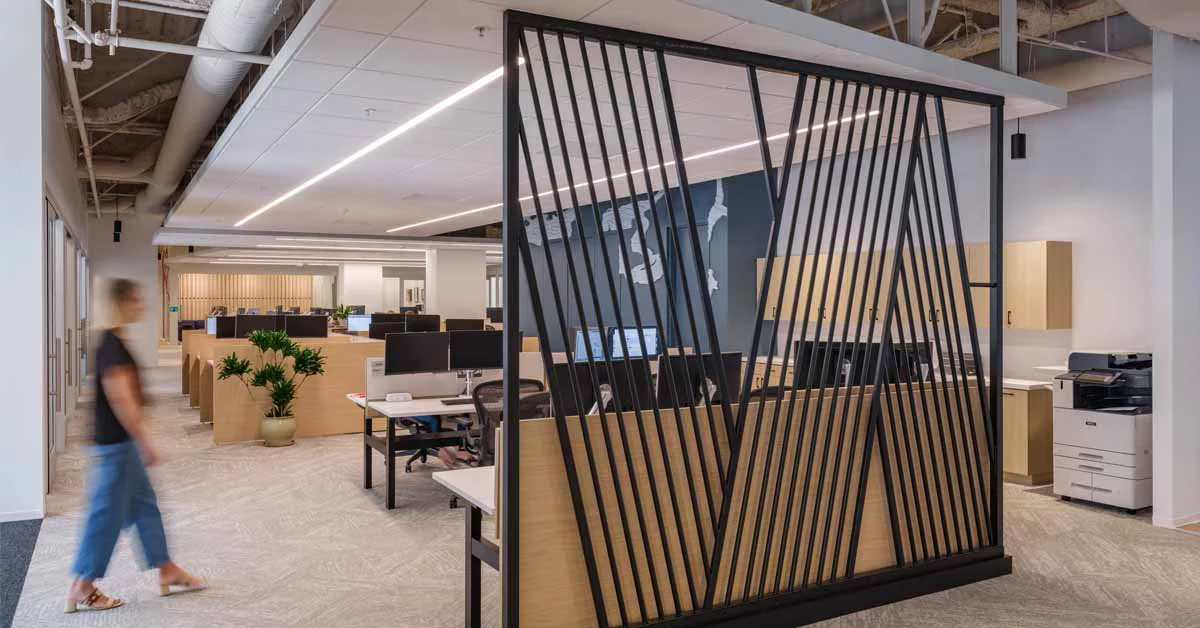 Open office space featuring a desk and chairs arranged for collaborative work.