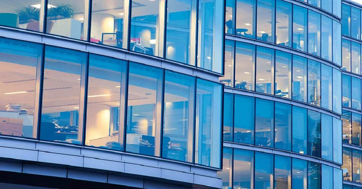 A modern glass structure with multiple windows