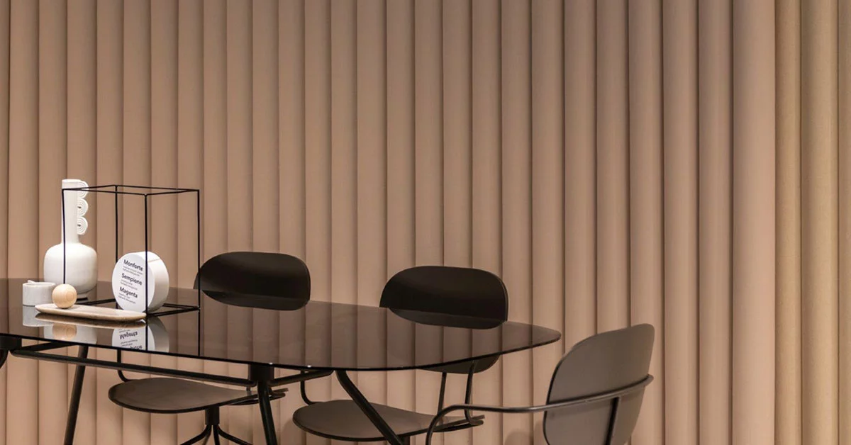 A dining table set with chairs and a decorative vase in the center