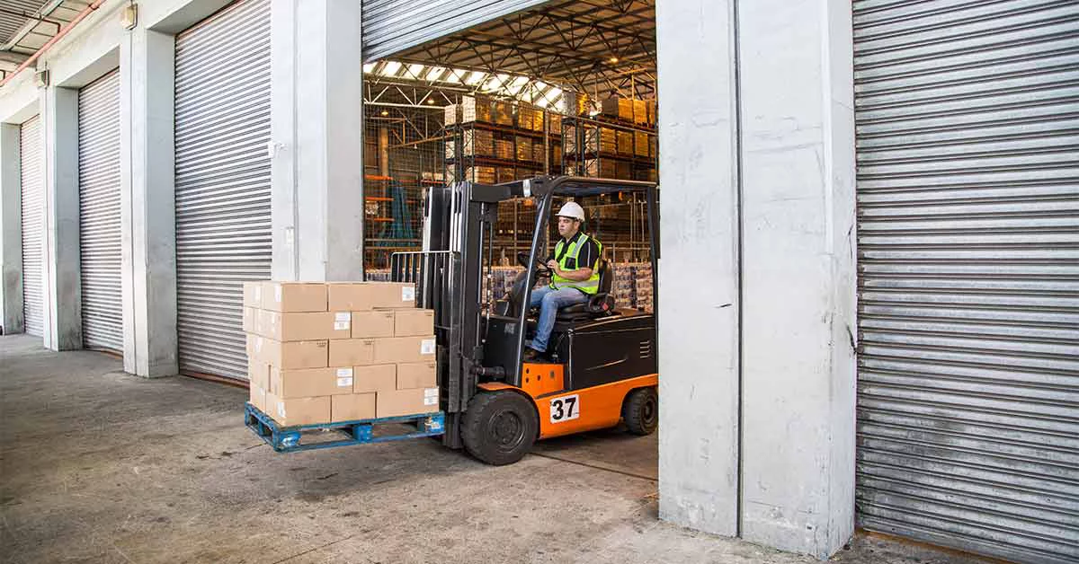 Man driving a forklift