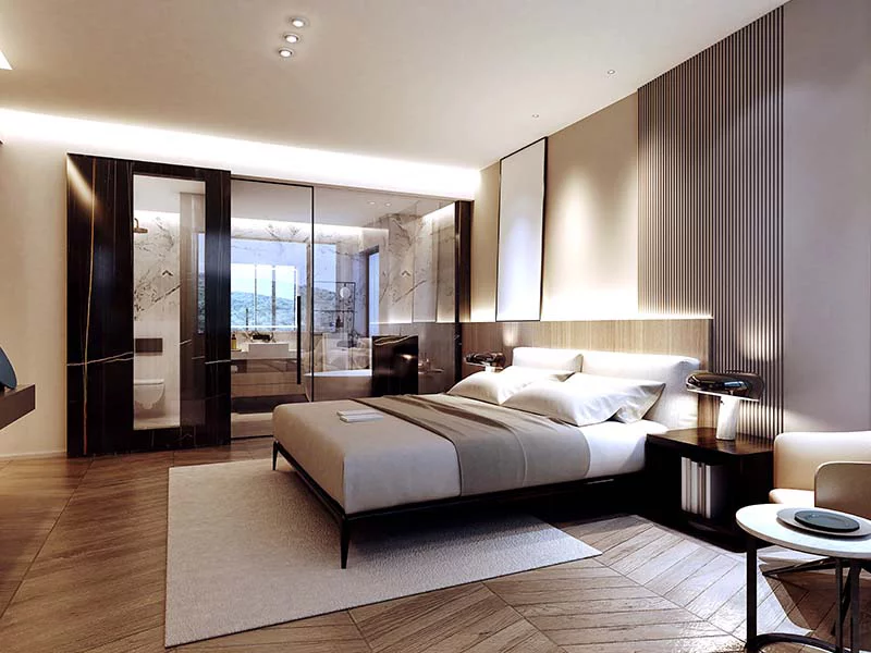  A modern bedroom featuring a large bed and an expansive mirror reflecting the stylish decor and soft lighting.