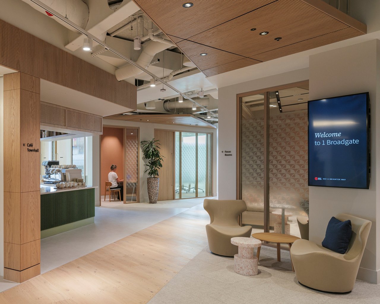 Client meeting suit at JLL 1 Broadgate with clear wayfinding, seating and barista bar